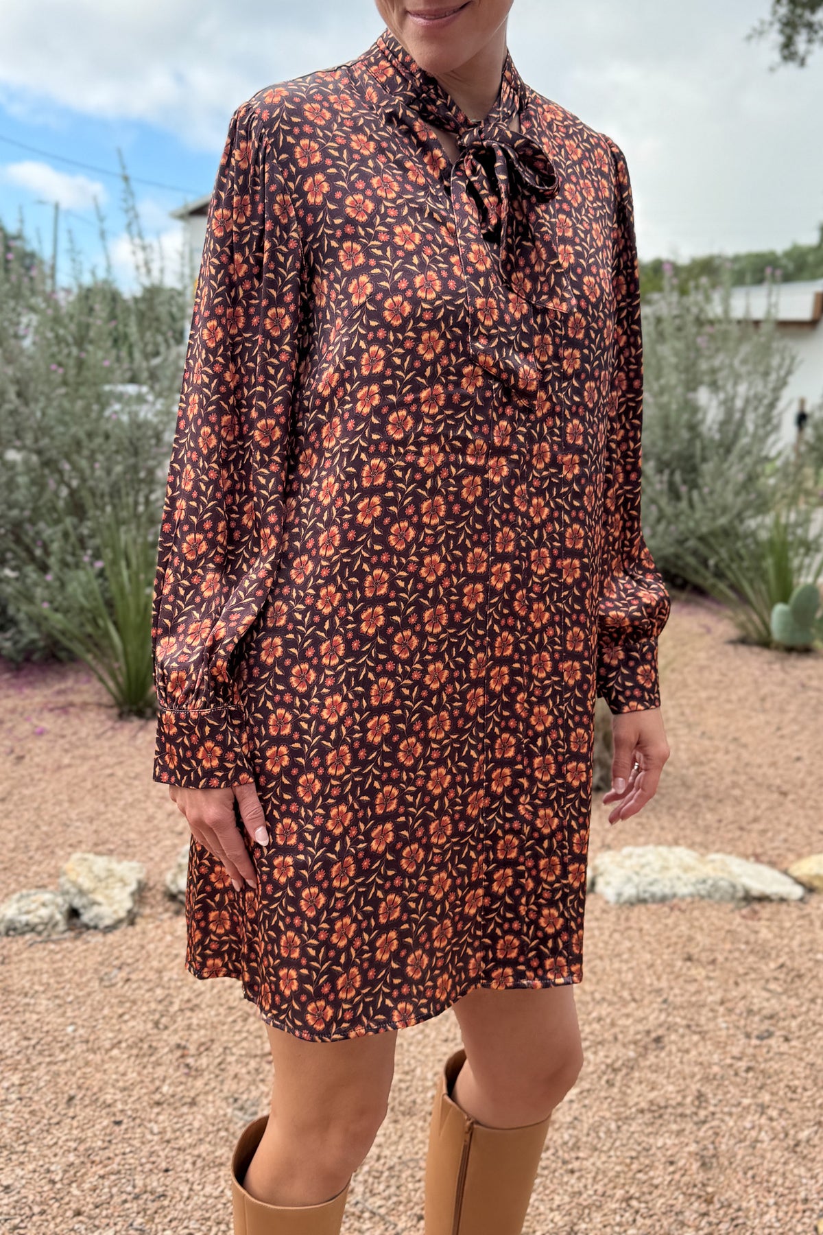 &nbsp;A fresh pop of autumn blooms makes this 34" dress a standout for any occasion. Designed in soft 100% viscose, it flows effortlessly with a relaxed silhouette and features a feminine tie-neck detail for an added touch of charm.