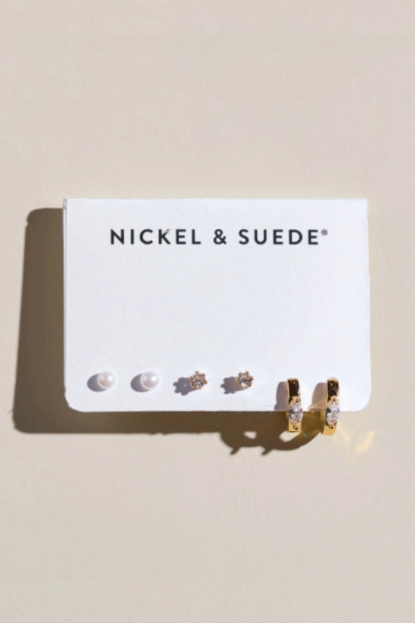 Nickel & Suede Gold Essential Dainty Earrings Set featuring pearl studs, sparkling gold studs, and petite gold huggie hoops with clear stone accents.