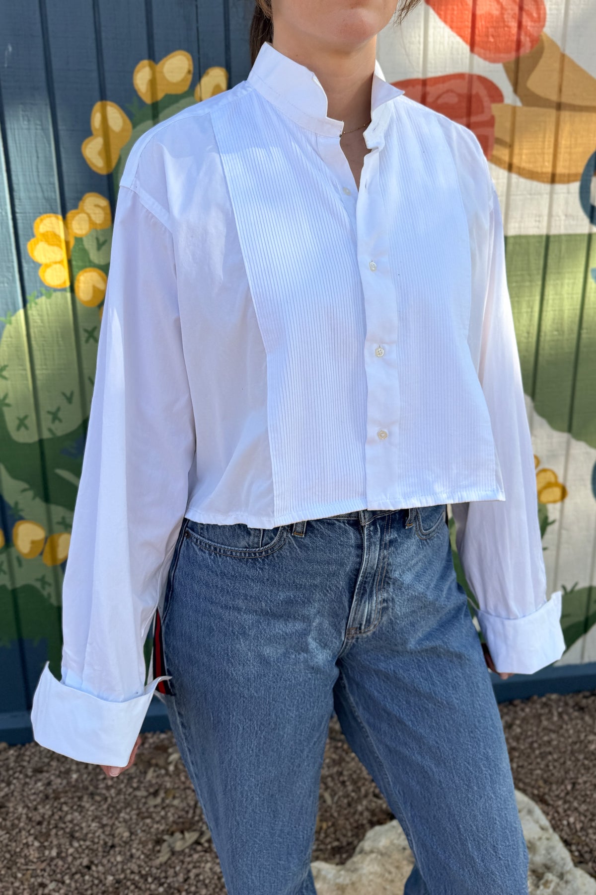 The modern Stormy button-down is designed to move with you for an easy, elevated feel. The cropped front flows into a longer back for a flattering high-low shape that adds interest to a classic style. Finished details give this piece a polished look that works dressed up or casual.