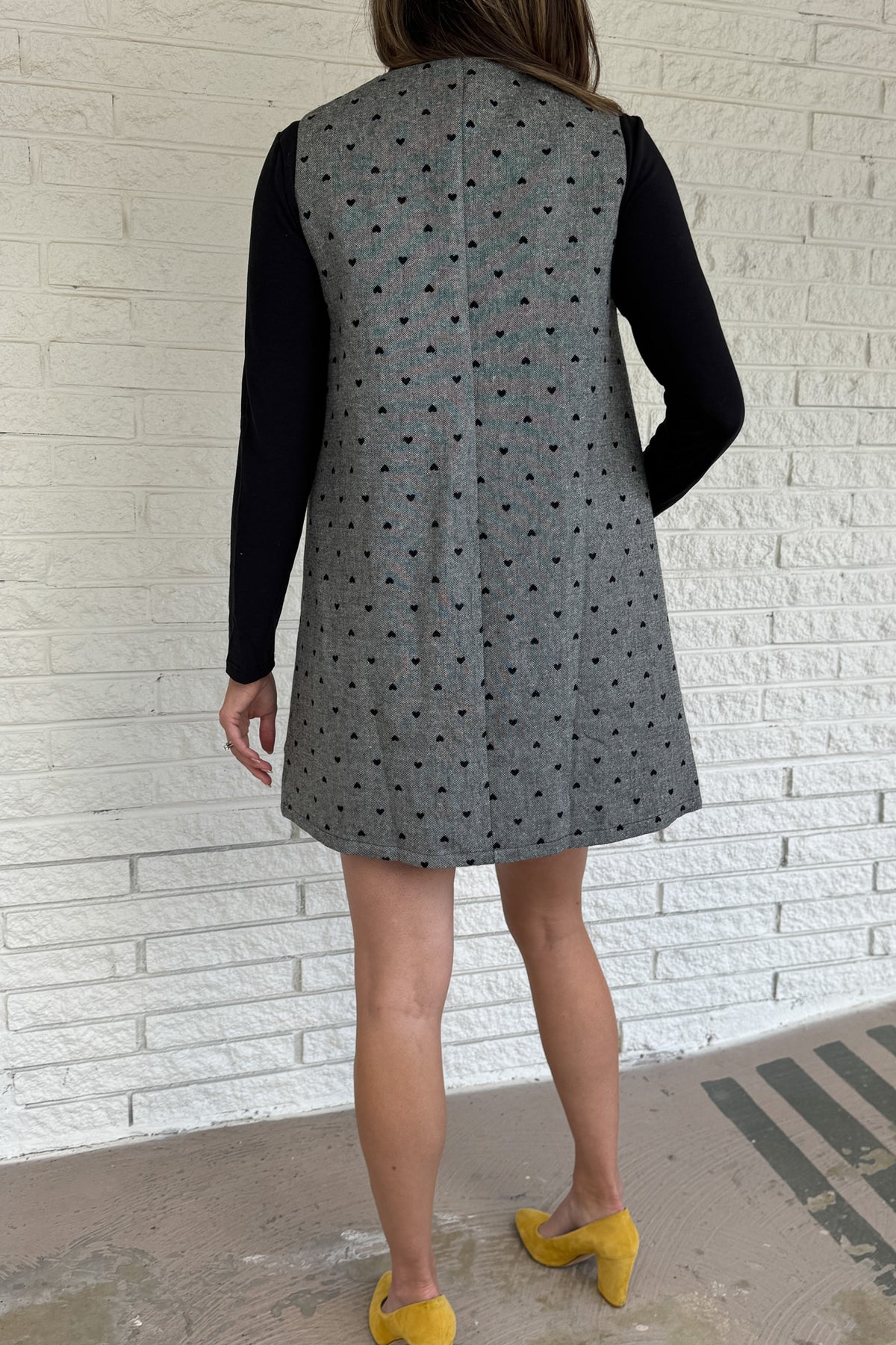 Designed in Spain, this timeless shift dress is a modern take on classic style. Fully lined and finished with subtle textured details, it’s an easy piece to layer through the seasons. Pair it with a blouse or turtleneck for an effortlessly polished look that works from day to night.