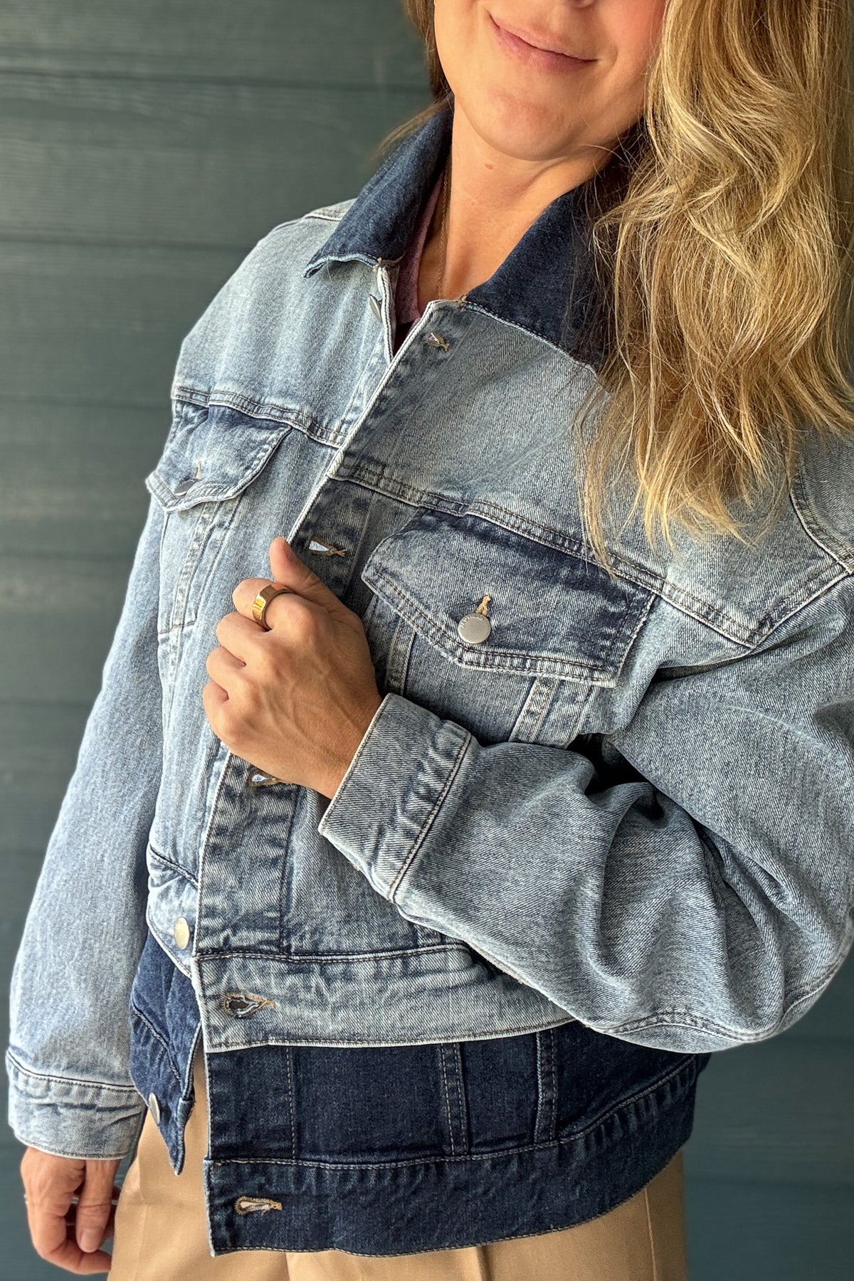 Women’s two-tone denim jacket with light wash body, dark wash collar and contrasting dark denim hem at Cotton & Cashmere boutique in Blanco, Texas.