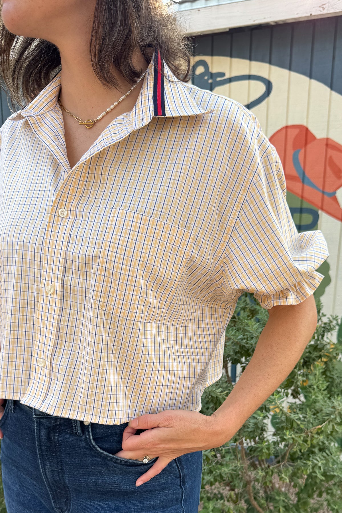 One-of-a-kind VonVie Harlow shirt made from a reclaimed button-down with ruffle sleeves and adjustable ribbon ties.