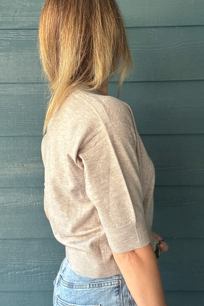 Back and side view of a taupe short sleeve knit polo sweater with a relaxed fit and ribbed hem at Cotton & Cashmere women’s boutique.