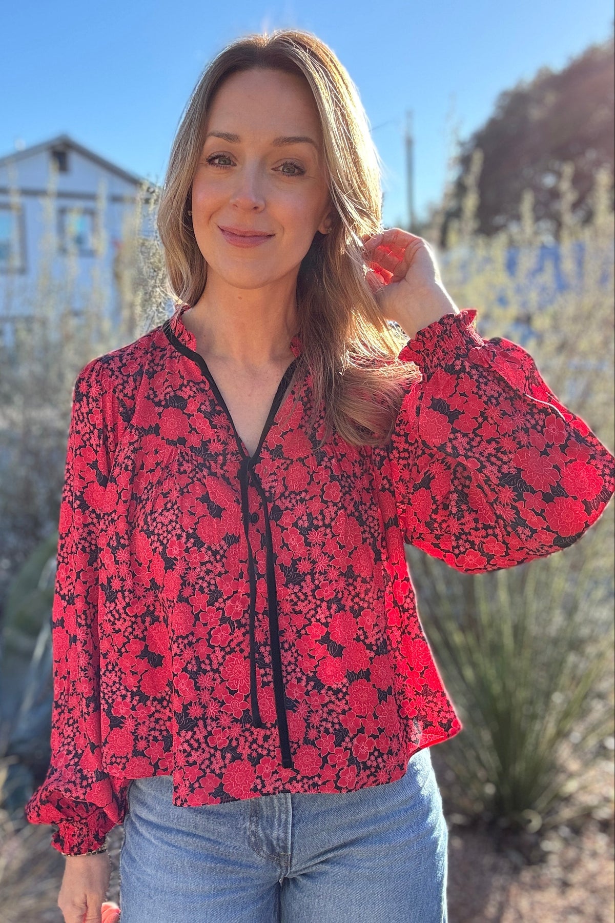 red and black floral blouse, hits at the waistline, velvet ribbon detailing
