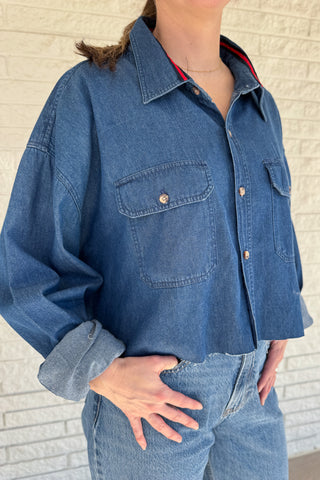 An upcycled men’s shirt reworked into a cropped, raw hem, easy silhouette that feels fresh and relaxed. Soft, classic, and one-of-a-kind. Designed to be a one size fits most, wear it buttoned up and it fits like medium or large. Women's fashion boutique Blanco Texas Johnson City Texas