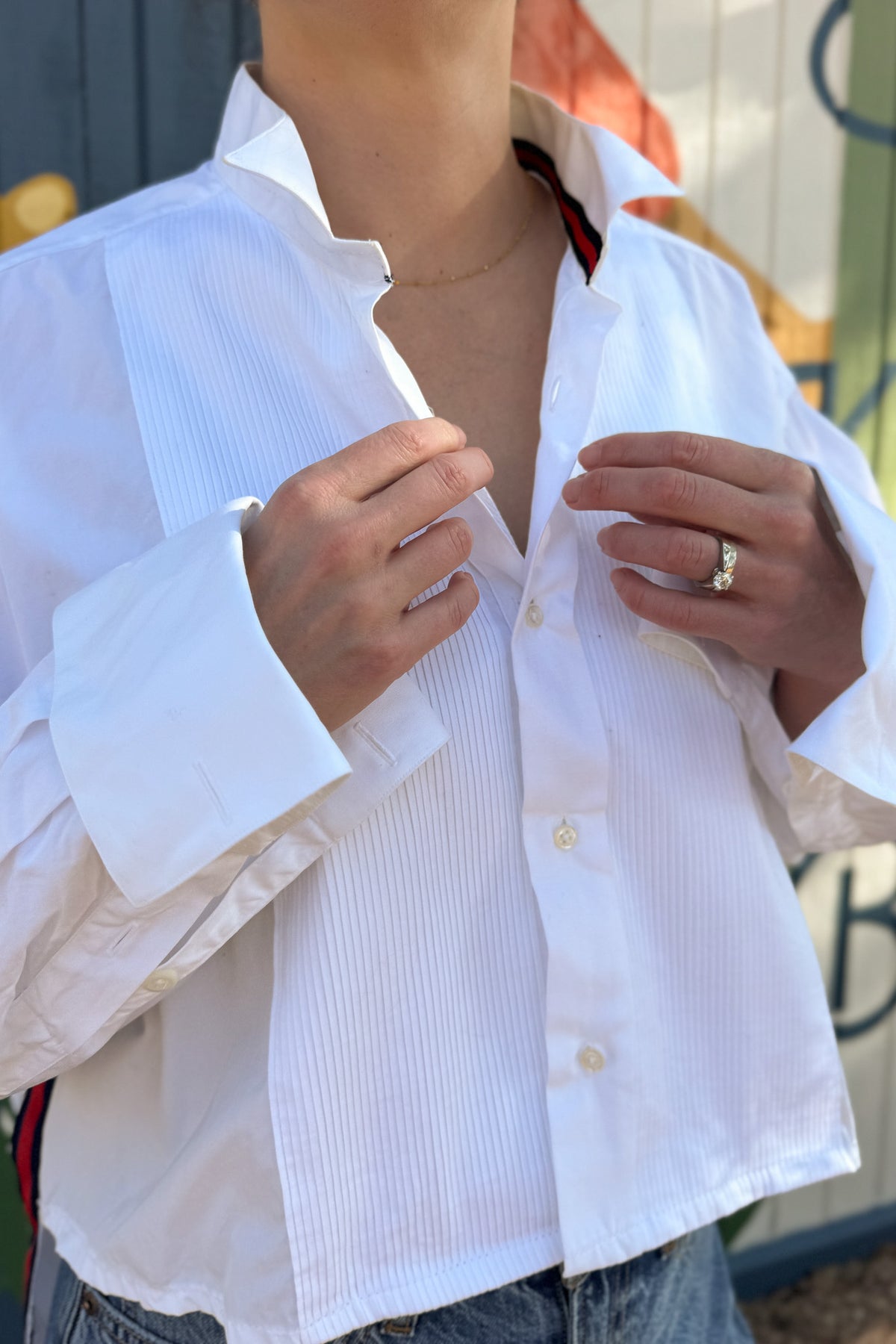 The modern Stormy button-down is designed to move with you for an easy, elevated feel. The cropped front flows into a longer back for a flattering high-low shape that adds interest to a classic style. Finished details give this piece a polished look that works dressed up or casual.