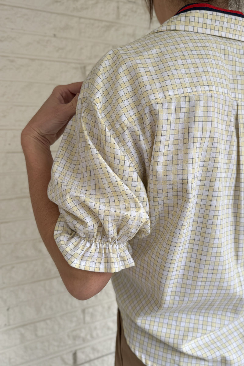 An upcycled men’s shirt reworked into a cropped, finished hem, easy silhouette that feels fresh and relaxed. Soft, breathable, and one-of-a-kind. Designed to be a one size fits most, this blouse fits sizes small to large. Women's fashion boutique Blanco Texas