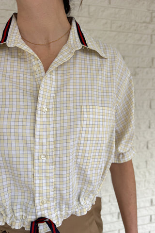 An upcycled men’s shirt reworked into a cropped, finished hem, easy silhouette that feels fresh and relaxed. Soft, breathable, and one-of-a-kind. Designed to be a one size fits most, this blouse fits sizes small to large. Women's fashion boutique Blanco Texas