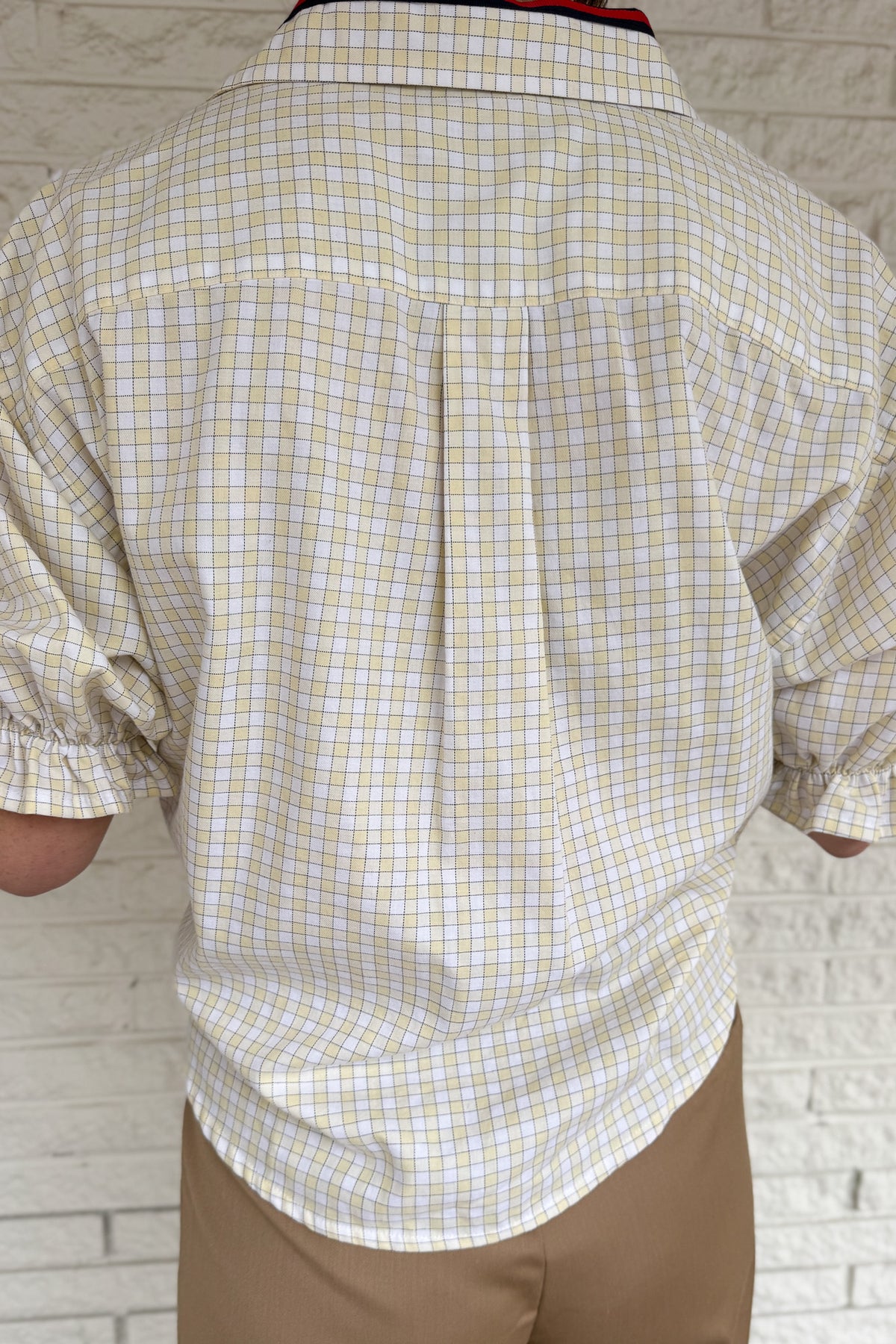 An upcycled men’s shirt reworked into a cropped, finished hem, easy silhouette that feels fresh and relaxed. Soft, breathable, and one-of-a-kind. Designed to be a one size fits most, this blouse fits sizes small to large.