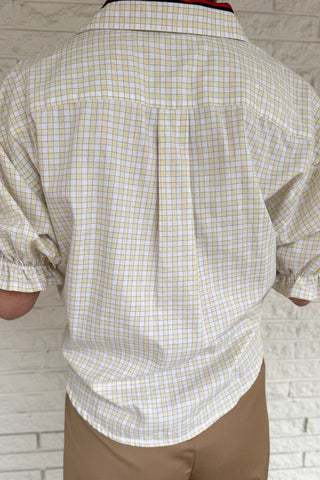 An upcycled men’s shirt reworked into a cropped, finished hem, easy silhouette that feels fresh and relaxed. Soft, breathable, and one-of-a-kind. Designed to be a one size fits most, this blouse fits sizes small to large. Women's fashion boutique Blanco Texas