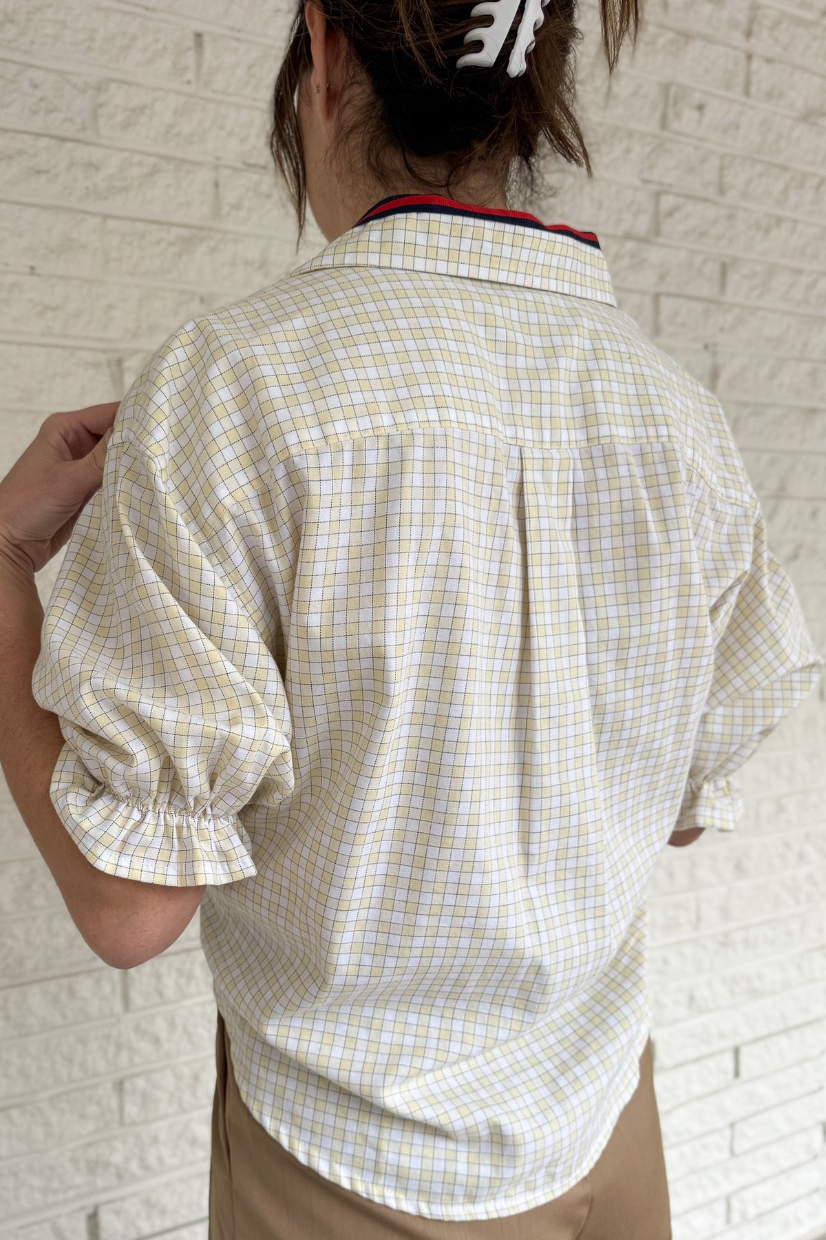 An upcycled men’s shirt reworked into a cropped, finished hem, easy silhouette that feels fresh and relaxed. Soft, breathable, and one-of-a-kind. Designed to be a one size fits most, this blouse fits sizes small to large.