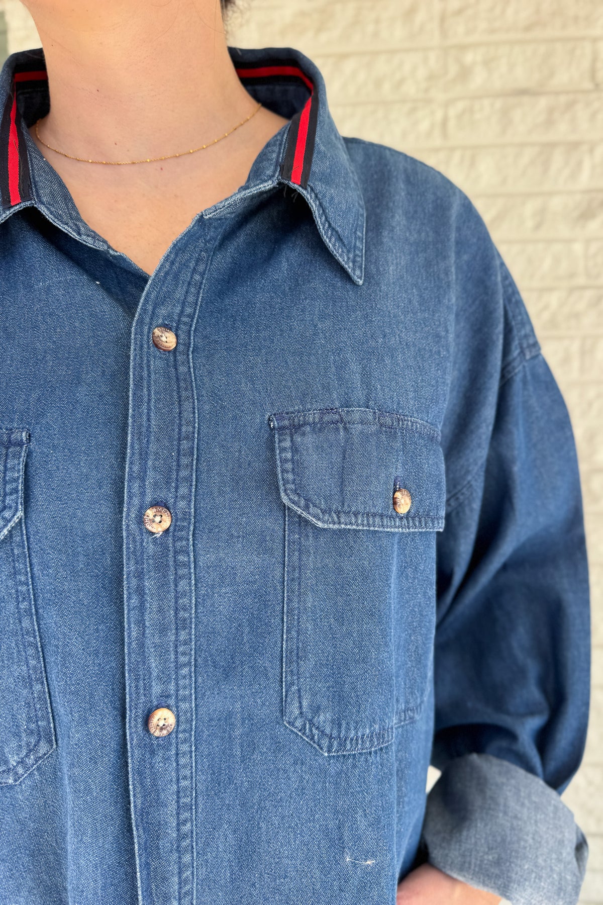 An upcycled men’s shirt reworked into a cropped, raw hem, easy silhouette that feels fresh and relaxed. Soft, classic, and one-of-a-kind. Designed to be a one size fits most, wear it buttoned up and it fits like medium or large.