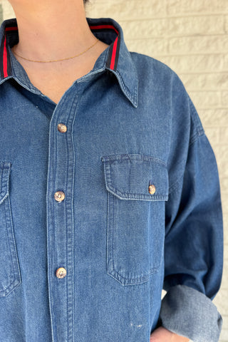 An upcycled men’s shirt reworked into a cropped, raw hem, easy silhouette that feels fresh and relaxed. Soft, classic, and one-of-a-kind. Designed to be a one size fits most, wear it buttoned up and it fits like medium or large. Women's fashion boutique Blanco Texas Johnson City Texas