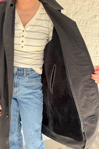 The Von Jacket by Vonvie is a one of a kind upcycled men’s jacket reworked for everyday wear. This piece blends classic structure with unique, thoughtful details for a look that feels effortless but elevated. Designed to layer easily, it features a removable fur lining for versatile wear through changing seasons. Grosgrain ribbon accents at the cuffs add a subtle pop of contrast and an unexpected design detail that sets this jacket apart. Women's fashion boutique Blanco Texas