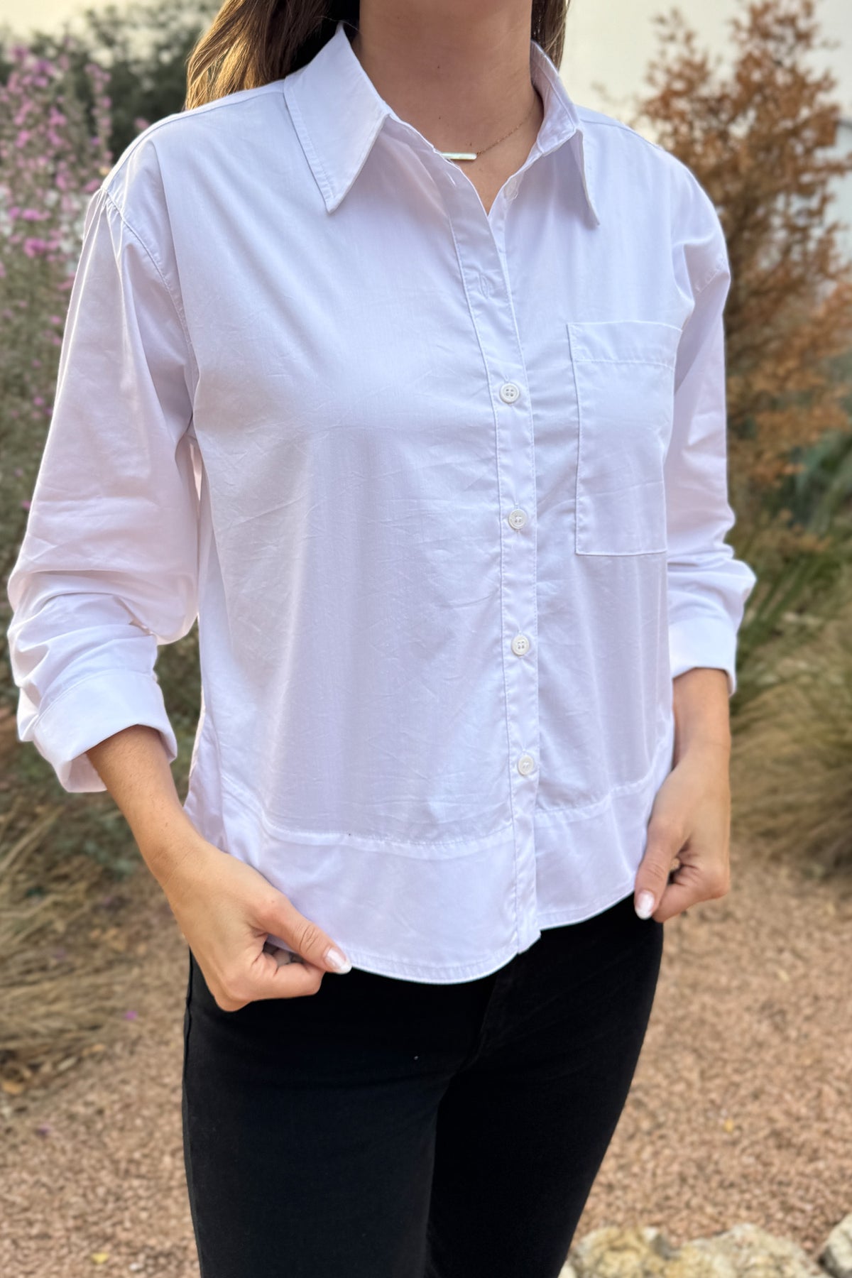 Your go to white blouse when you want clean, effortless style. Designed with a high/low hem for easy movement and a relaxed, modern drape. Lightweight with just a touch of stretch, it’s perfect for everyday wear;&nbsp; polished enough for meetings, easy enough for school drop-off and errands.