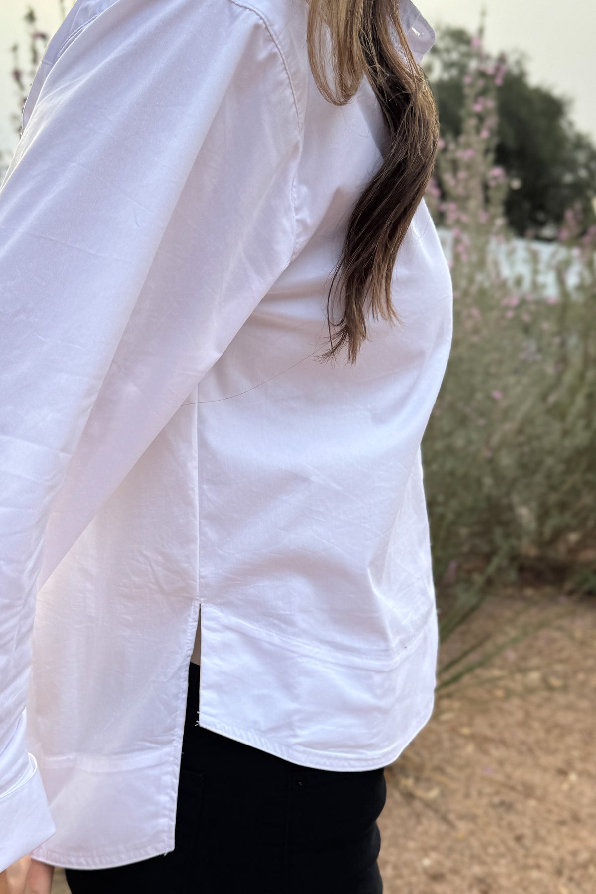 Your go to white blouse when you want clean, effortless style. Designed with a high/low hem for easy movement and a relaxed, modern drape. Lightweight with just a touch of stretch, it’s perfect for everyday wear;&nbsp; polished enough for meetings, easy enough for school drop-off and errands.