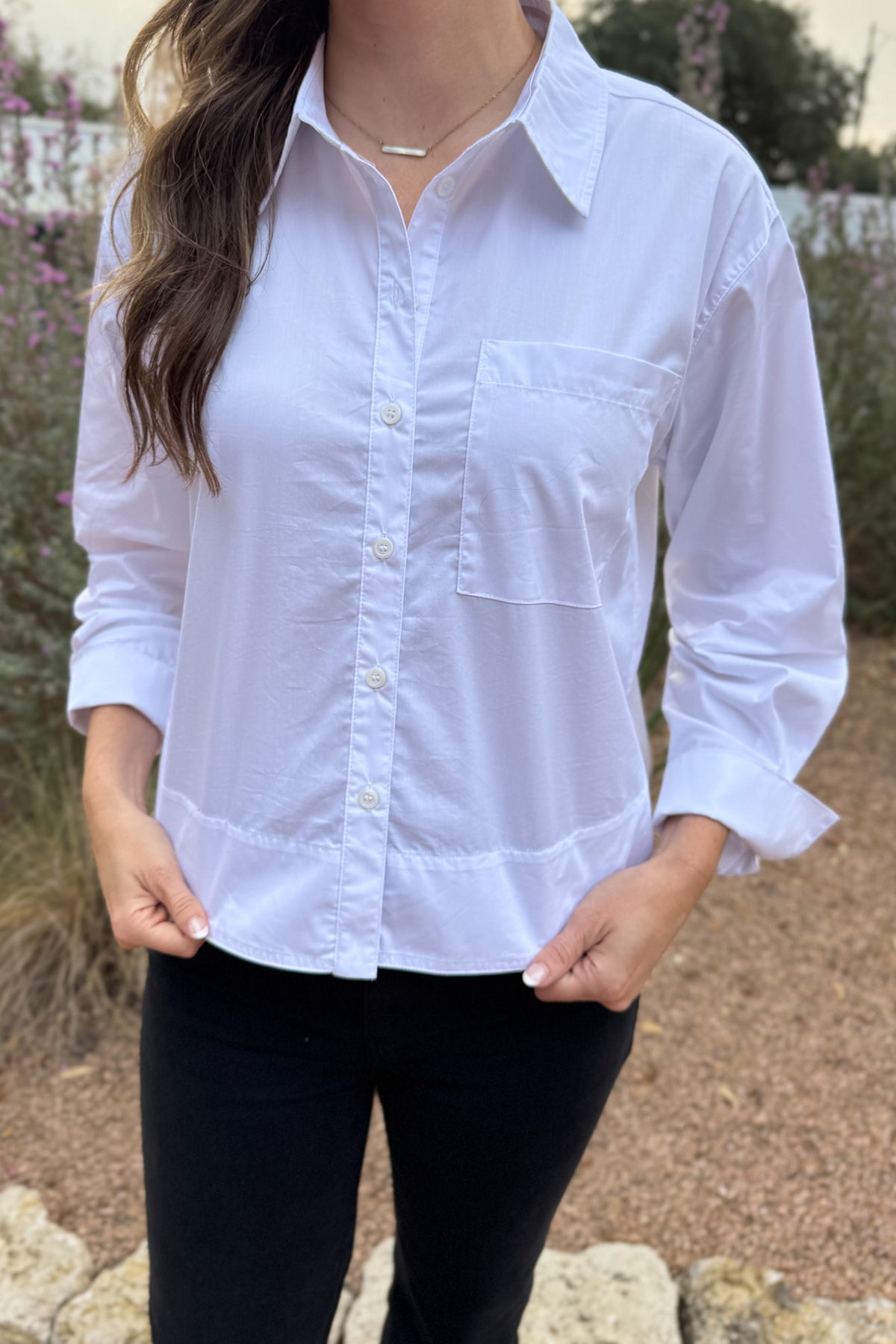 Your go to white blouse when you want clean, effortless style. Designed with a high/low hem for easy movement and a relaxed, modern drape. Lightweight with just a touch of stretch, it’s perfect for everyday wear;&nbsp; polished enough for meetings, easy enough for school drop-off and errands.
