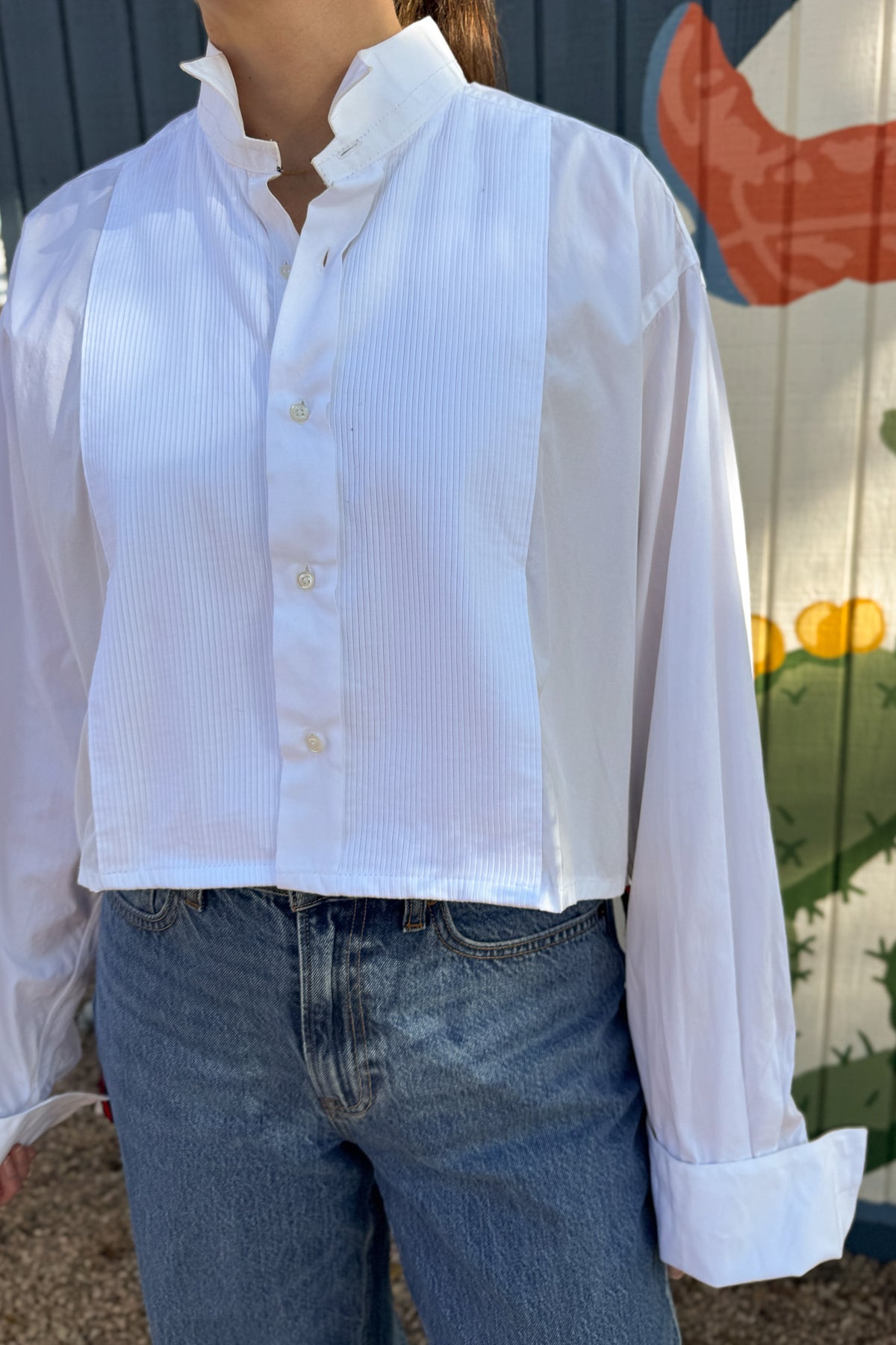 The modern Stormy button-down is designed to move with you for an easy, elevated feel. The cropped front flows into a longer back for a flattering high-low shape that adds interest to a classic style. Finished details give this piece a polished look that works dressed up or casual.