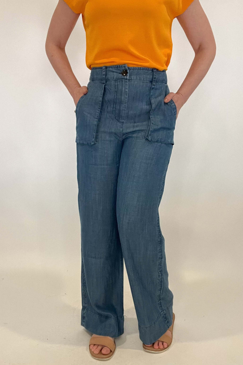 Upgrade your wardrobe with our sophisticated Wide Leg Chambray Pant. Made with luxurious chambray fabric and featuring unique 3d pockets, a button front, and an elastic waist in the back for ultimate comfort. Perfect for spring, these pants offer the look of denim with unmatched comfort. Elevate your style with these pants.