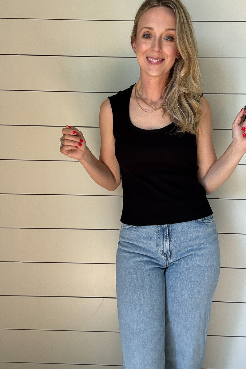 This black ribbed tank is a must-have staple for any wardrobe. Designed with a flattering sweetheart neckline and wide shoulder coverage, it offers a chic yet effortless look that’s perfect for layering or wearing on its own. The fitted silhouette hugs your curves in all the right places, while the ribbed texture adds a touch of sophistication.