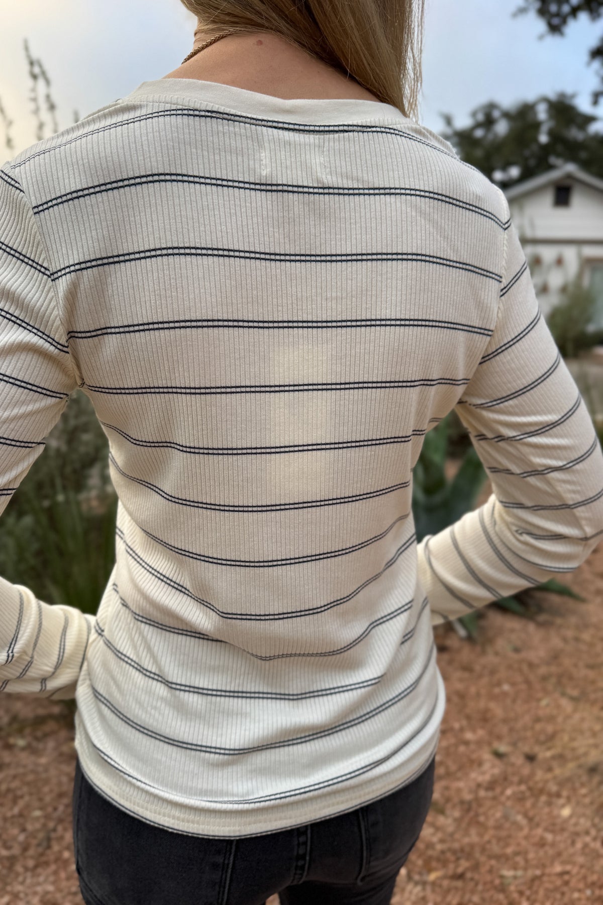 A timeless stripe with an easy, flattering fit,&nbsp; this ribbed henley top is a closet essential. The soft, stretchy knit moves with you while the button neckline adds a touch of laid-back polish. Perfect for layering or pairing with denim for effortless everyday style.