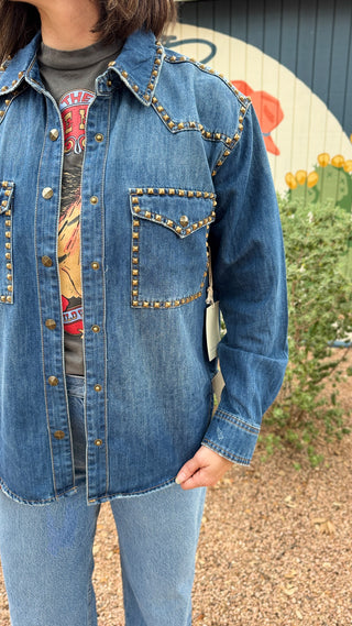 shoulder detail women’s studded denim shirt jacket in medium wash with antique gold stud details, western-inspired seams and front patch pockets at Cotton & Cashmere in Blanco, Texas.