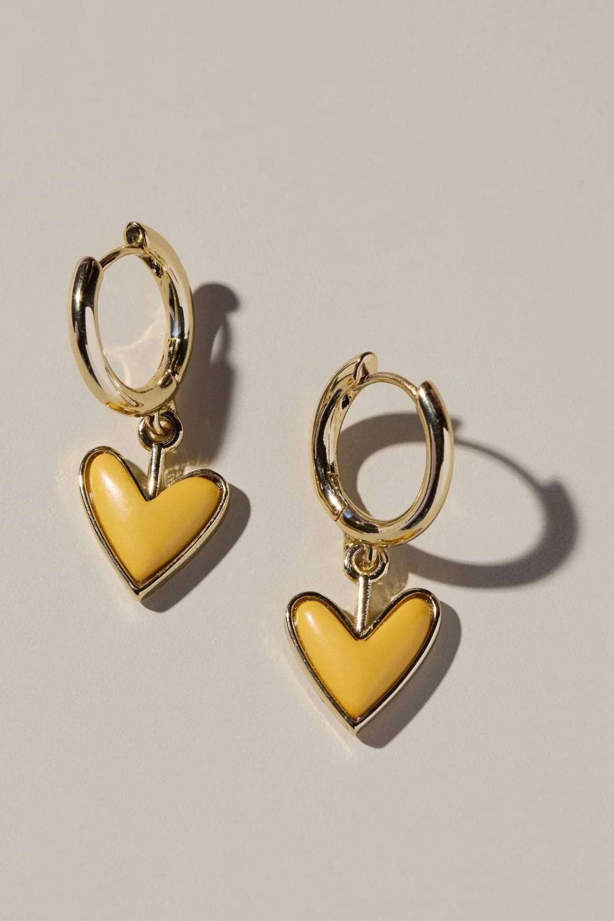 small hoop earrings, enamel earrings, 14k gold plated earrings, titanium post earrings, nickel free earrings, women’s fashion jewelry, boutique earrings, playful everyday earrings, modern hoop earrings, effortless style accessories, Cotton & Cashmere boutique, Blanco Texas boutique, women’s jewelry online, trendy huggie earrings

