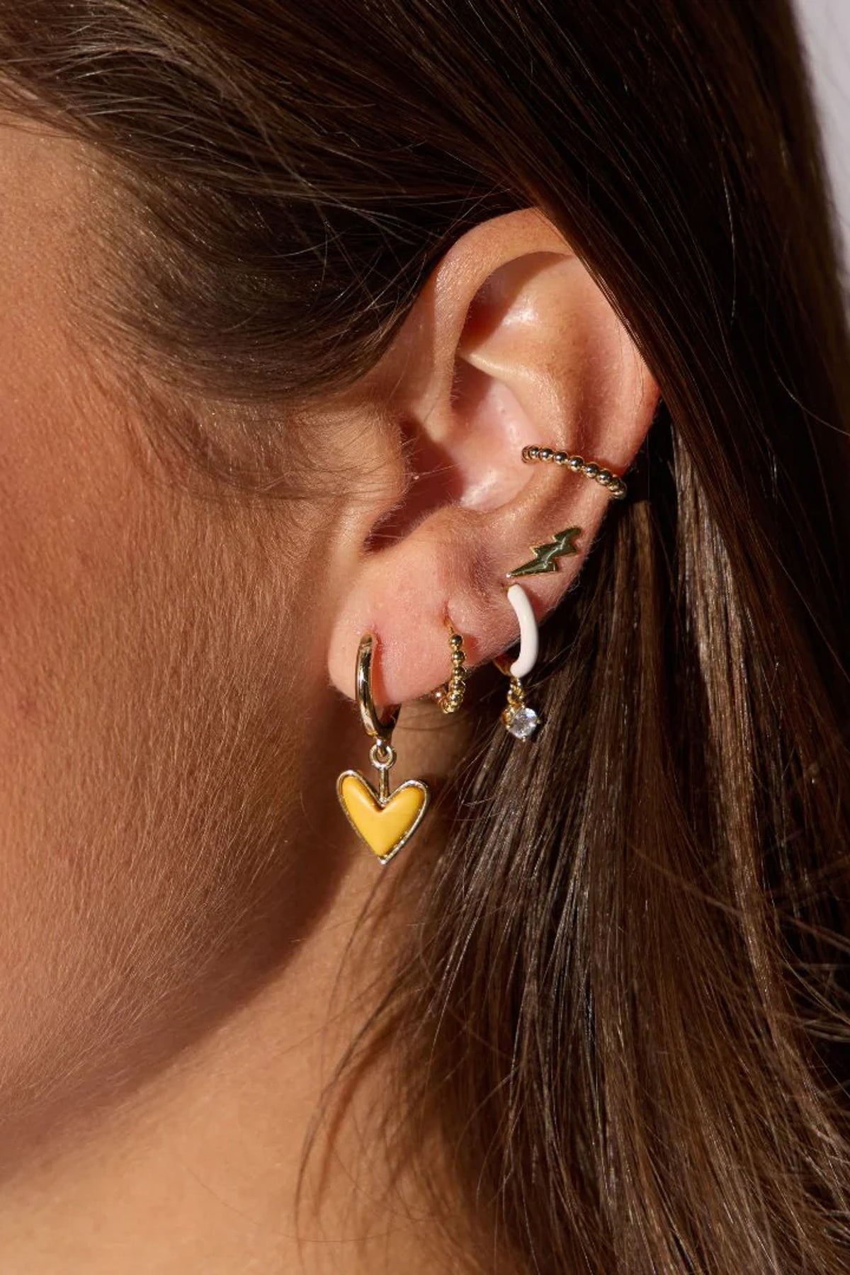 small hoop earrings, enamel earrings, 14k gold plated earrings, titanium post earrings, nickel free earrings, women’s fashion jewelry, boutique earrings, playful everyday earrings, modern hoop earrings, effortless style accessories, Cotton & Cashmere boutique, Blanco Texas boutique, women’s jewelry online, trendy huggie earrings

