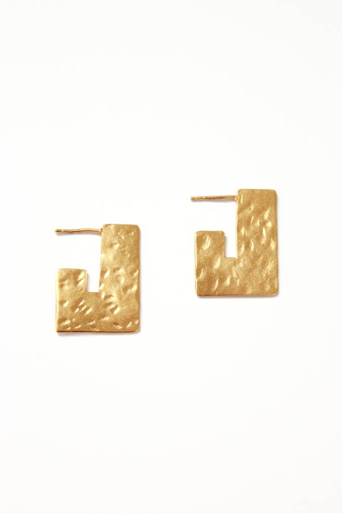 <p>-Ethically made in India</p> <p>-.75" wide x 1" high</p> <p>-Hammered brass with gold plating</p> <p>-Nickel-free ear post&nbsp;</p>