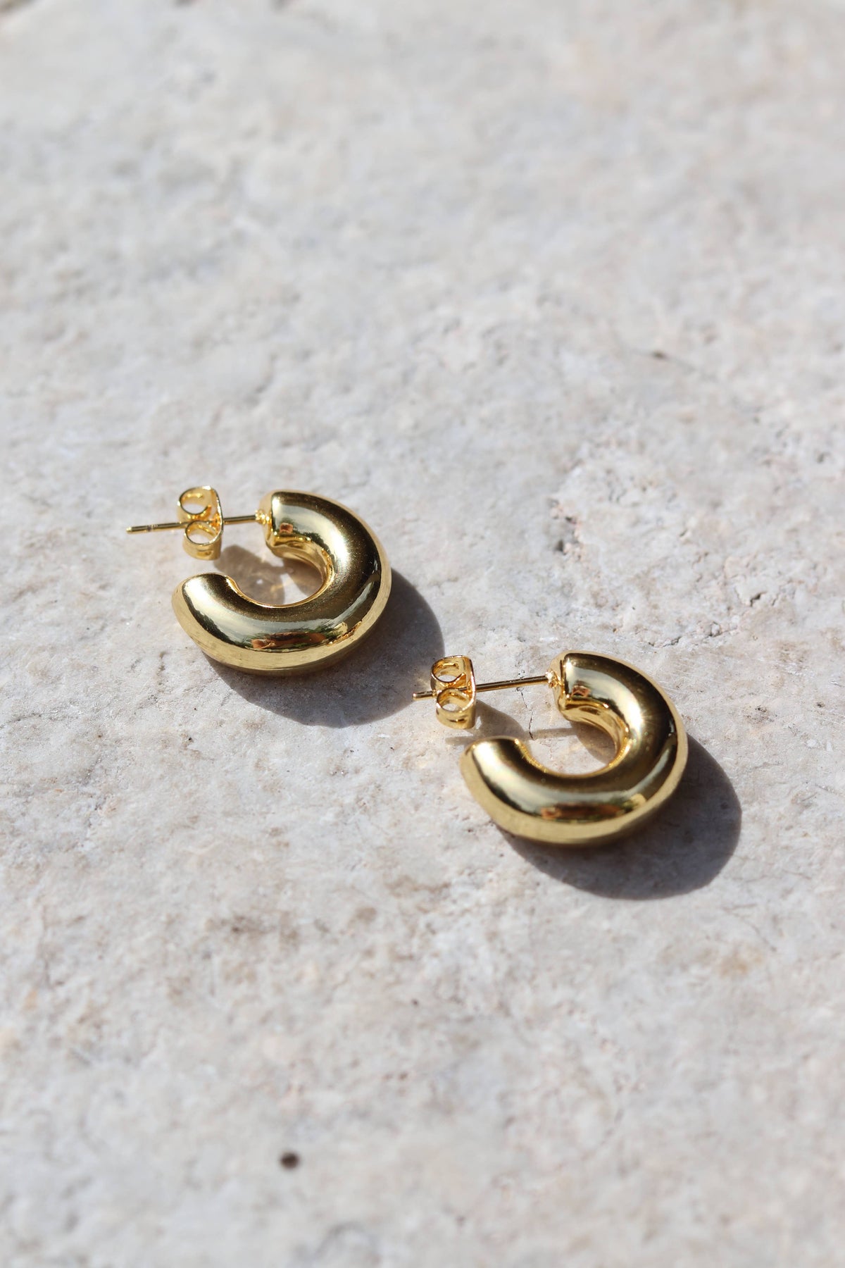 The miniature version of the Audrey hoop! Made from light weigh, waterproof, stainless steel with a gold plated finish. They are so fun and trendy, hypoallergenic and perfect for all occasions, these hoops are a stylish and versatile addition to your wardrobe.